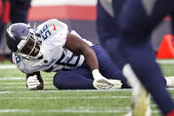 Tennessee Titans outside linebacker Monty Rice (56) reacts after an apparent injury during the first half of an NFL football game against the New England Patriots, Sunday, Nov. 28, 2021, in Foxborough, Mass. (AP Photo/Mary Schwalm)