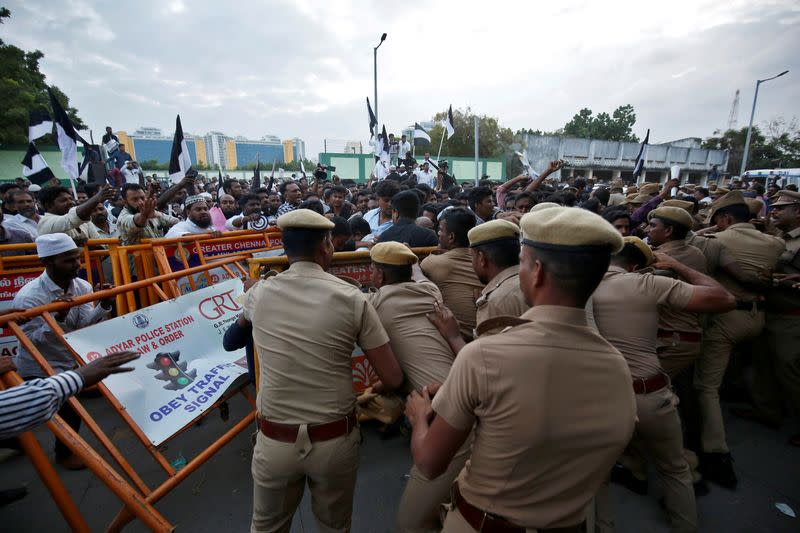 Police stop demonstrators during a protest against a new citizenship law, in Chennai