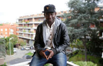 Yankouba Gassama, 21, from Gambia, poses onthe terrace of his room in a shelter in Rome, Italy, November 23, 2016. REUTERS/Max Rossi