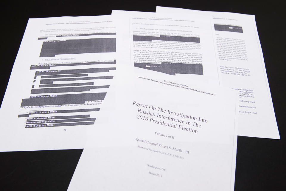 A few pages of Special Counsel Robert Mueller's report on Russian interference in the 2016 election that were printed out by staff in the House Judiciary Committee's hearing room on April 18, 2019. | Tom Williams—CQ Roll Call/Getty Images