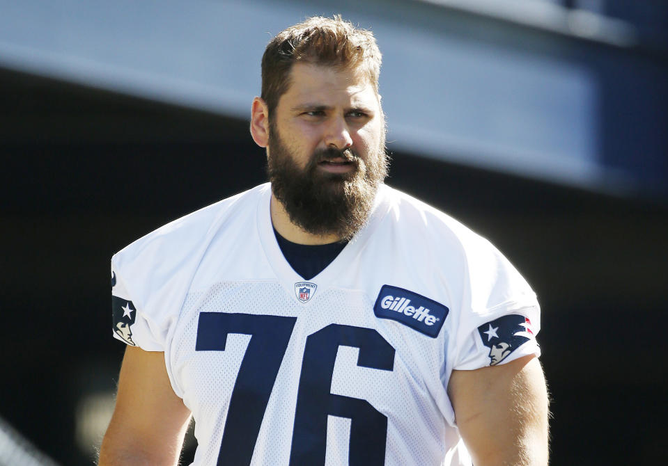 FILE - New England Patriots tackle Sebastian Vollmer (76) walks on the field during an NFL football training camp practice, July 30, 2016, in Foxborough, Mass. Several German players have had success in the NFL. Sebastian Vollmer won two Super Bowl rings as an offensive lineman for the New England Patriots, protecting quarterback Tom Brady over an eight-year span. (AP Photo/Michael Dwyer, file)