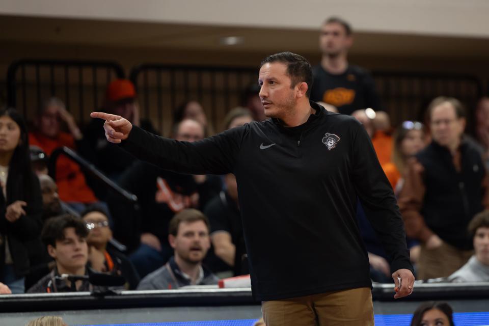 Feb 18, 2024; Stillwater, Okla, USA; Oklahoma State Associate Head Coach Coleman Scott reacts on the sides of the mat during a wrestling bout at Gallagher-Iba Arena against Oklahoma in Stillwater, Okla. Mandatory Credit: Mitch Alcala-The Oklahoman