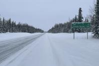 A sign displays the distance to Tok, Alaska, and the Canada border in Glennallen, Alaska on Feb. 1, 2023. Many electric vehicle batteries lose power when it's very cold. It's something that's long been known by engineers but thousands of people are confronting the issue now if they own an electric car and have to make a longer trip when temperatures dip.(AP Photo/Mark Thiessen)