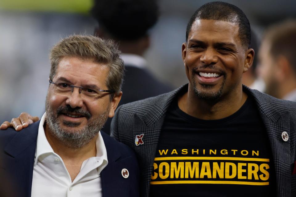 Washington Commanders owner Dan Snyder (L) and president Jason Wright  (R) pose for a photo before the game against the Dallas Cowboys at AT&T Stadium.