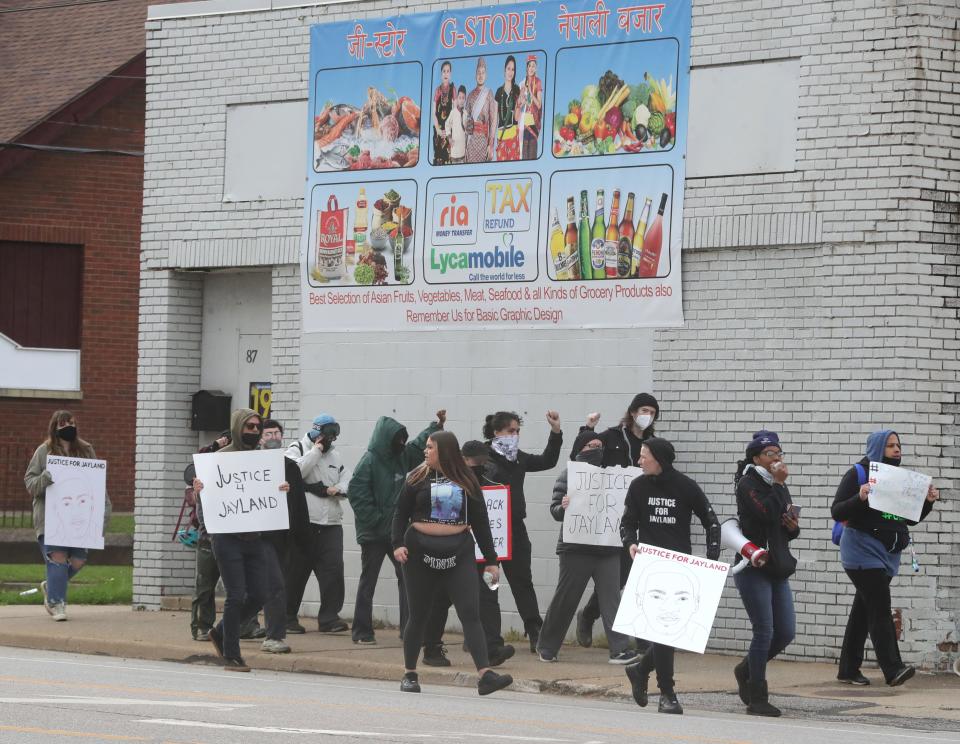 Jayland Walker protesters march along East Tallmadge Avenue on Monday, April 24, 2023, in Akron.