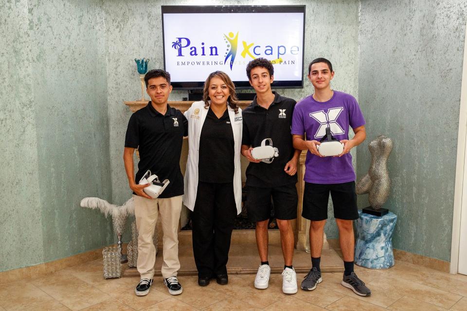 Dr. Mersedeh Karimian and Xavier College Prep High School seniors Eduardo Chaparro, left, Milad Ilbeigi and Daniel Reed are helping some older residents manage their pain symptoms with virtual reality at Donya Spa in Rancho Mirage, Calif., on September 8, 2023.
