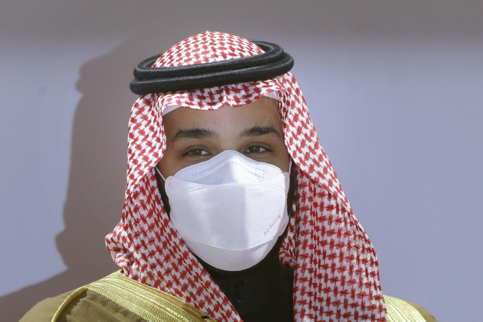 FILE - In this Feb. 20, 2021, file photo, Saudi Crown Prince Mohammed bin Salman wears a face mask to help curb the spread of the coronavirus as he attends the Saudi Cup award ceremony during the final race of the $20 million, the Saudi Cup, at King Abdul Aziz race track in Riyadh, Saudi Arabia. Top Biden administration officials on Tuesday, July 6, hosted a brother to Saudi Arabia's powerful crown prince, Mohammed bin Salman, in the highest-level such visit known since the U.S. made public intelligence findings linking the crown prince to the killing of journalist Jamal Khashoggi. (AP Photo/Amr Nabil, File)