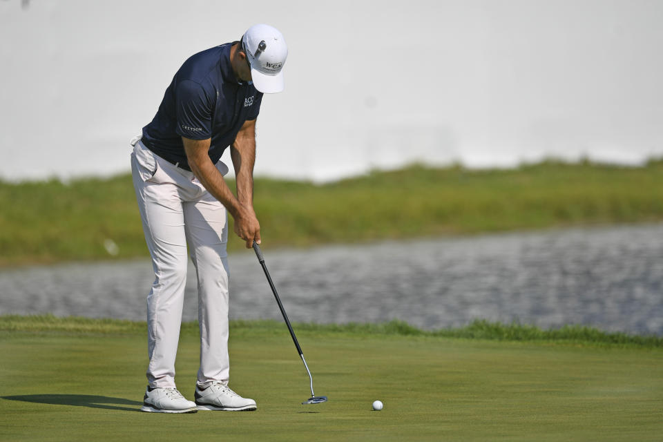 Cameron Tringale makes his final putt on the 18th hole to take the lead at 12 under par during the third round of the 3M Open golf tournament in Blaine, Minn., Saturday, July 24, 2021. (AP Photo/Craig Lassig)