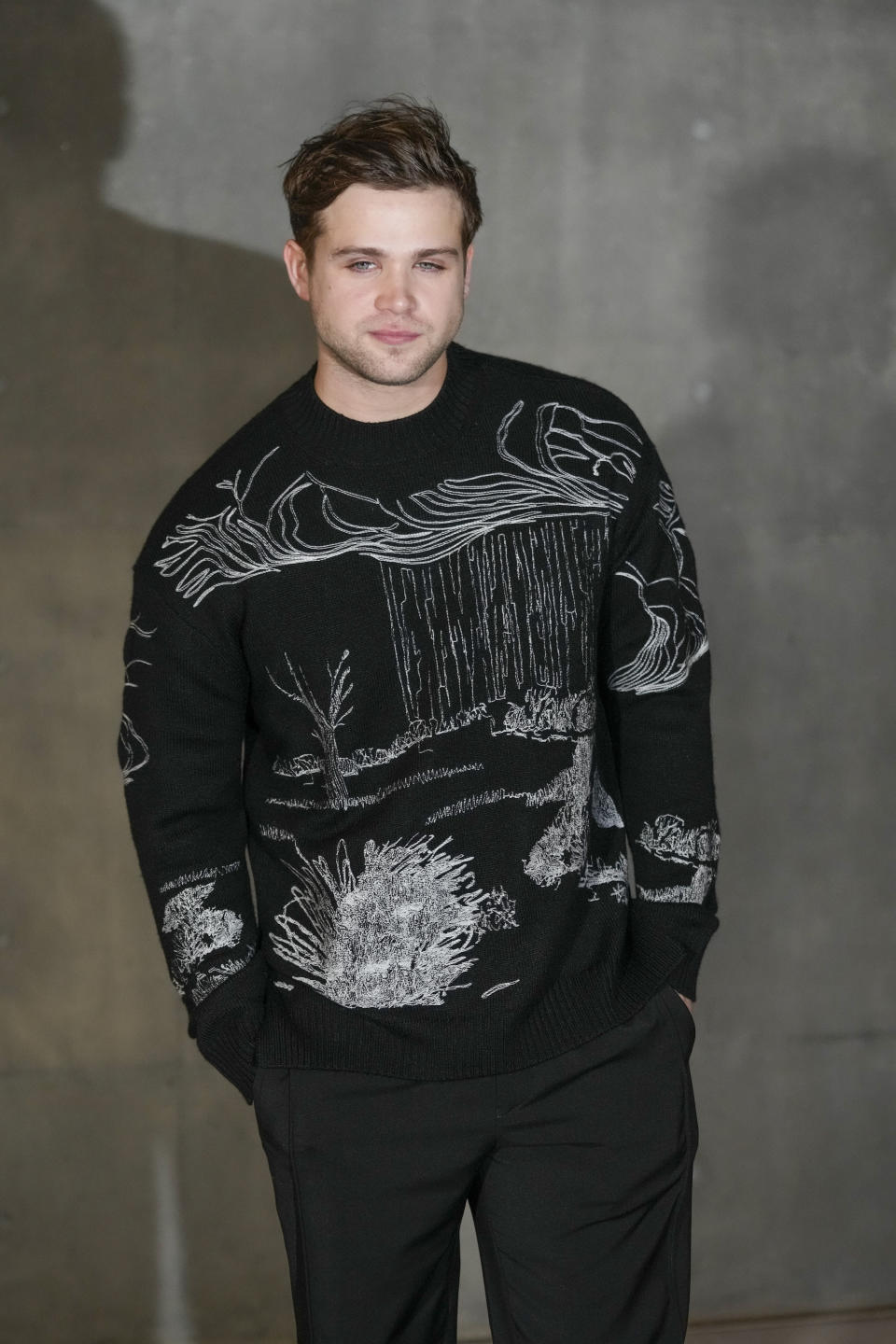 Leo Woodall attends the men's Giorgio Armani Fall-Winter 2024-2025 collection, that was presented in Milan, Italy, Saturday, Jan. 13, 2024. (AP Photo/Luca Bruno).