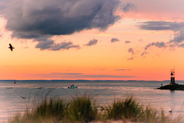 <p>Justin Kaneps</p> Sunset over Montauk, as seen from the dunes near Gin Beach.