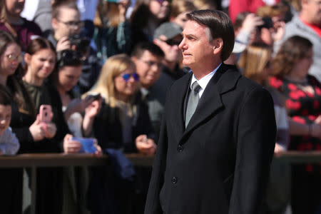 Brazil's President Jair Bolsonaro arrives during ceremonies to lay a wreath at the Tomb of the Unknown Soldier at Arlington National Cemetery during his visit to Washington in Arlington, Virginia, U.S., March 19, 2019. REUTERS/Jonathan Ernst