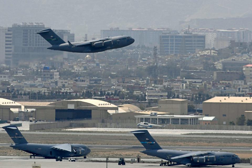 An US Air Force aircraft takes off from the airport in Kabul on August 30, 2021. Rockets were fired at Kabul's airport on August 30 where US troops were racing to complete their withdrawal from Afghanistan and evacuate allies under the threat of Islamic State group attacks. 