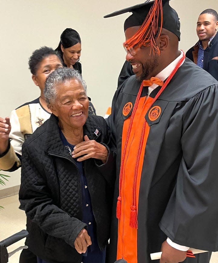 Jamel Byrd, a new graduate of Campbell University is graduated by his 95-year-old grandmother, who attended his commencement ceremony held on Thursday, Nov. 2, 2023 at Scotland Correctional Institution. The graduates are inmates at Sampson Correctional Institution and are part of the Second Chance Initiative, sponsored by the Bob Barker Foundation and operated by the Campbell and N.C. Dept. of Adult Correction.