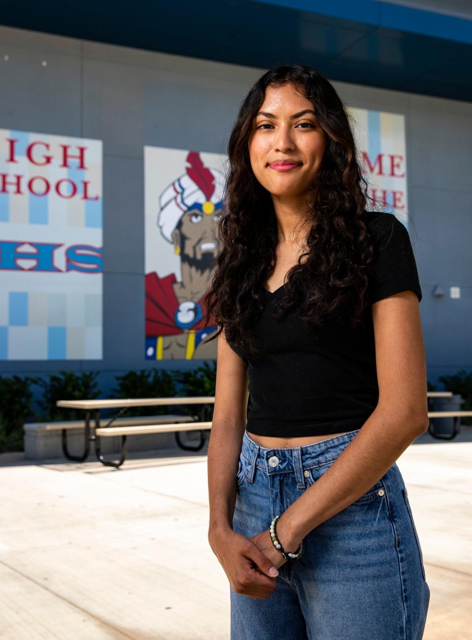 Graduate Belinda Castaneda poses for a photo at Indio High School in Indio, Calif., Wednesday, May 24, 2023. 