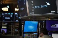 A sign displays the name of Credit Suisse on the floor at the New York Stock Exchange in New York, Wednesday, March 15, 2023. (AP Photo/Seth Wenig)