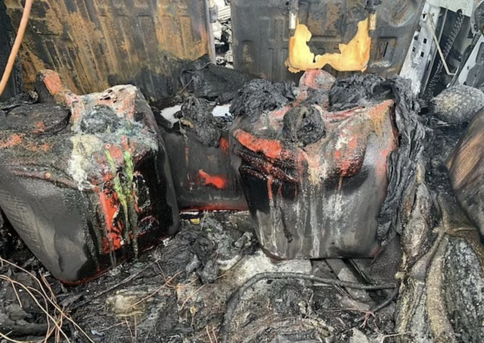 The inside of a Hummer is seen melted after a fire.