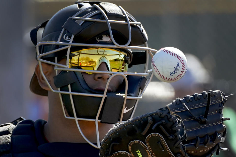 Arizona Diamondbacks catcher Gabriel Moreno tosses a ball during an MLB spring training baseball practice, Monday, Feb. 20, 2023, in Scottsdale, Ariz. (AP Photo/Matt York)