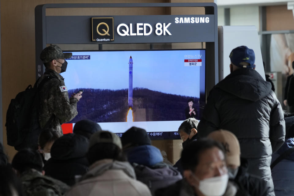 A TV screen shows an image of North Korea's rocket with the test satellite during a news program at the Seoul Railway Station in Seoul, South Korea, Monday, Dec. 19, 2022. North Korea said Monday it fired a test satellite in an important final-stage test for the development of its first spy satellite, a key military capability coveted by its leader Kim Jong Un along with other high-tech weapons systems. (AP Photo/Ahn Young-joon)