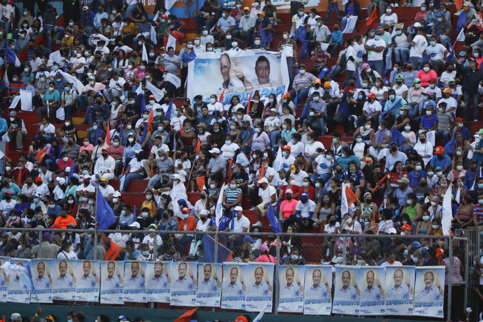 Supporters of the National Party presidential candidate Nasry Asfura gather for a closing campaign rally, in Tegucigalpa, Honduras, Sunday, Nov. 21, 2021. Honduras will hold its presidential election on Nov. 28. (AP Photo/Elmer Martinez)