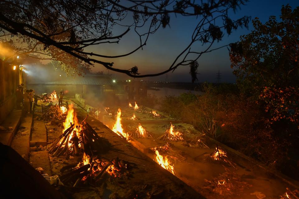 COVID-19 victims being cremated at Bhairav Ghat Hindu Crematory, as coronavirus cases surge in record numbers across the country, in Kanpur, Thursday, 22 April 2021.