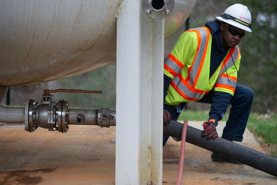 Hyannis Water Department's lead operator Davian Levy opens a valve under a treatment tank filled with activated charcoal used to treat groundwater for PFAS at a treatment plant off Mary Dunn Road in Hyannis. The tanks are periodically flushed out and filled with new charcoal.