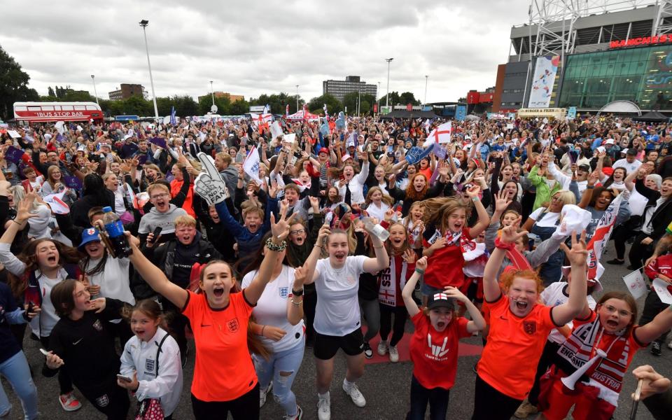 MANCHESTER, ENGLAND - JULY 06: Fans sing during the UEFA Womens EURO 2022 Fan and Spectator Experience at Old Trafford on July 06, 2022 in Manchester, England. - Anthony Devlin/Getty Images Europe
