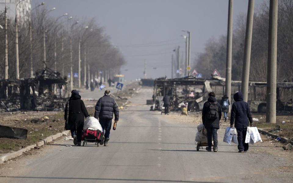 Civilians are being evacuated along humanitarian corridors from the Ukrainian city of Mariupol under the control of Russian military and pro-Russian separatists - Stringer/Anadolu Agency via Getty Images