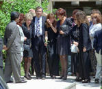 <p>That same day, June 16, 1994, Ron Goldman is laid to rest in nearby Westlake Village, Calif., by his father, Fred, left center, his stepmother, Patti, left, and sister Kim, center. (Photo: Kevork Djansezian/AP) </p>