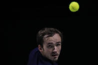 Russian Tennis Federation's Daniil Medvedev returns the ball to Croatia's Marin Cilic during their Davis Cup tennis finals at Madrid Arena in Madrid, Spain, Sunday, Dec. 5, 2021. (AP Photo/Manu Fernandez)