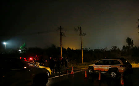 Police officers block a road close to the area of the B3/B4 mine operated by Vale SA that was evacuated, in Nova Lima, Brazil February 16, 2019. REUTERS/Cristiane Mattos