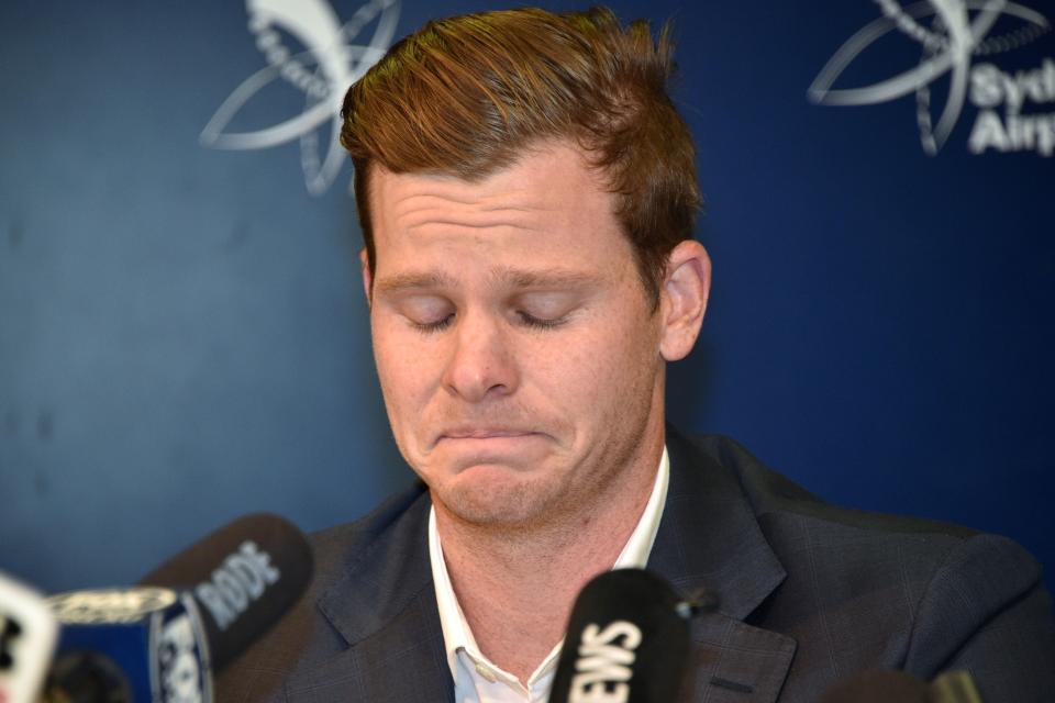 Cricketer Steve Smith reacts at a press conference at the airport in Sydney on March 29, 2018, after returning from South Africa.  Distraught Australian cricketer Steve Smith on March 29 accepted full responsibility for a ball-tampering scandal that has shaken the sport, saying he was devastated by his "big mistake". / AFP PHOTO / PETER PARKS / -- IMAGE RESTRICTED TO EDITORIAL USE - STRICTLY NO COMMERCIAL USE --        (Photo credit should read PETER PARKS/AFP via Getty Images)