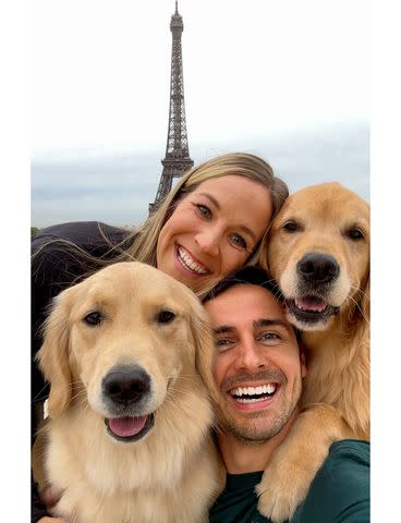 <p>@elliegoldenlife8BIM</p> Kevin and Katie Bubolz with dogs Emma and Ellie at the Eiffel Tower in Paris