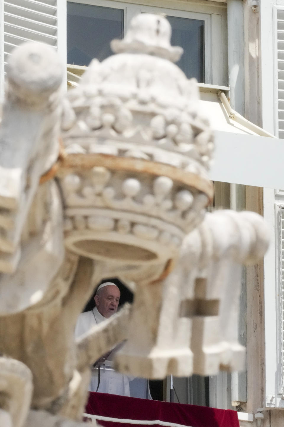 Pope Francis delivers his message during the Angelus noon prayer from the window of his studio overlooking St.Peter's Square, at the Vatican, Sunday, June 13, 2021. Francis demanded during his speech for humanitarian aid to reach residents of the war-torn Tigray region of northern Ethiopia, where Ethiopian and Eritrean soldiers are blocking food and other assistance. (AP Photo/Andrew Medichini)