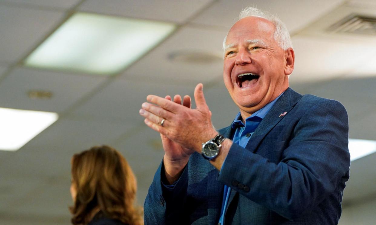 <span>Tim Walz applauds as he attends a campaign event with Kamala Harris at the United Auto Workers Local 900 in Wayne, Michigan, on Thursday.</span><span>Photograph: Elizabeth Frantz/Reuters</span>