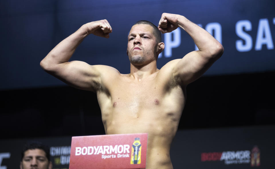 Welterweight fighter Nate Diaz poses on the scale during a ceremonial weigh-in for the UFC 279 mixed martial arts event Friday, Sept. 9, 2022, in Las Vegas. Diaz is scheduled to fight Tony Ferguson, a replacement for Khamzat Chimaev, who was overweight. (Steve Marcus/Las Vegas <a class="link " href="https://sports.yahoo.com/wnba/teams/connecticut/" data-i13n="sec:content-canvas;subsec:anchor_text;elm:context_link" data-ylk="slk:Sun;sec:content-canvas;subsec:anchor_text;elm:context_link;itc:0">Sun</a> via AP)