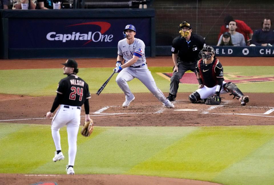 Texas Rangers shortstop Corey Seager (5) hits a two-run home run off of Arizona Diamondbacks relief pitcher Kyle Nelson (24) during the second inning during Game 4 of the 2023 World Series at Chase Field in Phoenix, AZ. The DBacks lost to the Rangers 11-7, putting the Ranger at 3-1 in the World Series.