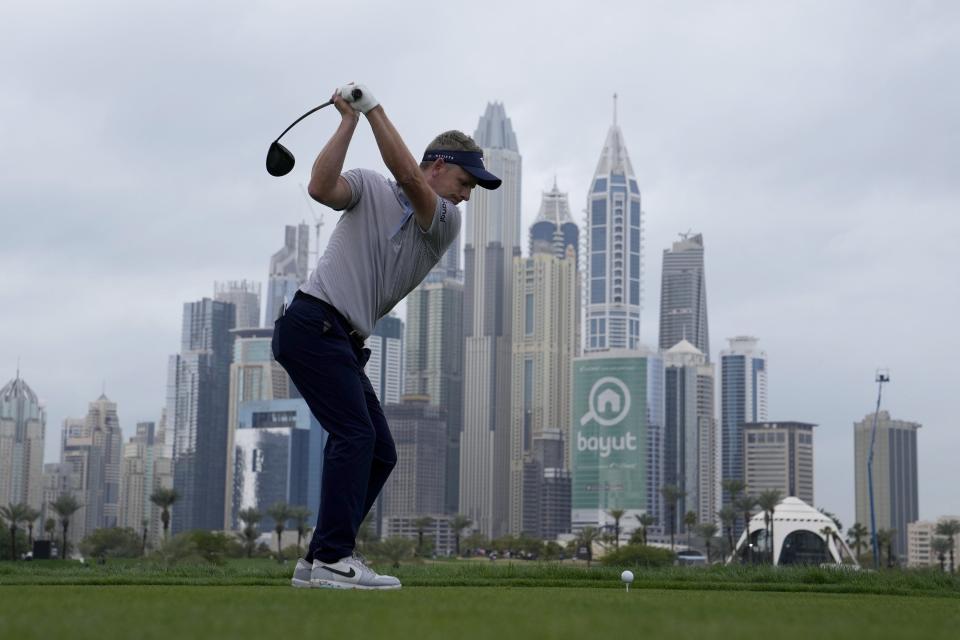 Luke Donald of England tees off on the 8th hole during his first round on Day Two of the Dubai Desert Classic, in Dubai, United Arab Emirates, Friday, Jan. 27, 2023. (AP Photo/Kamran Jebreili)