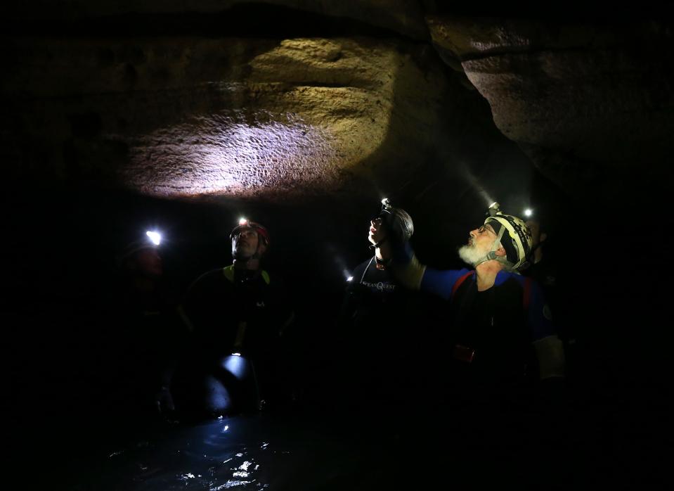 Cave scientist Ed Klausner points out formations on the wall of Coldwater Cave on May 17, 2014, in rural Winneshiek County in northeast Iowa.