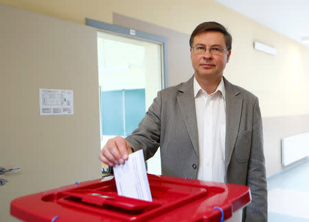 European Commission Vice-President for the Euro and Social Dialogue Valdis Dombrovskis casts his vote during European Parliament election in Riga, Latvia, May 25, 2019. REUTERS/Ints Kalnins