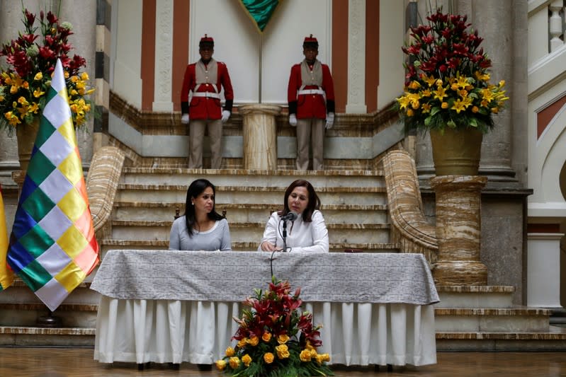 Bolivia's Foreign Minister Karen Longaric speaks next to Bolivia's Communication Minister Roxana Lizarraga during a news conference at the Presidential Palace, in La Paz