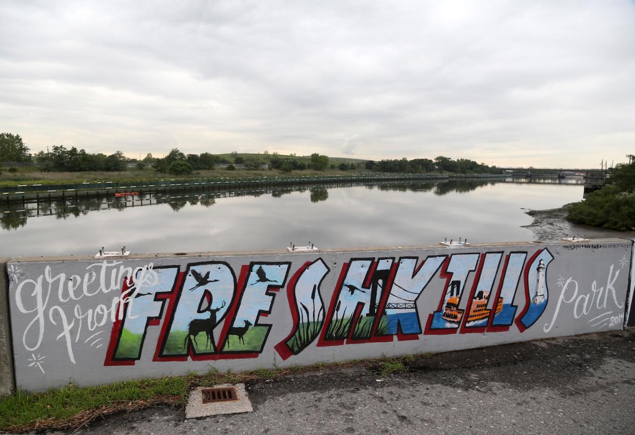 In this picture taken Thursday, Aug. 18, 2016, a painted sign adorns a bridge in Freshkills Park in the borough of Staten Island, New York.