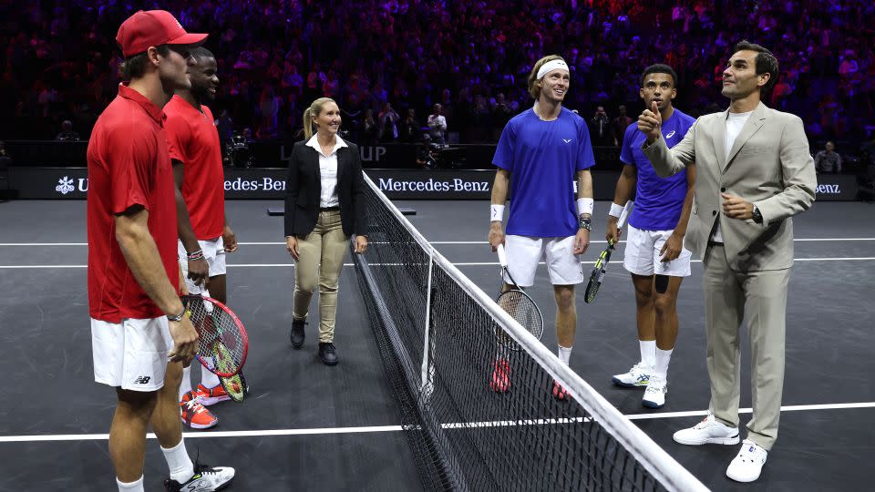 Federer on court for the coin toss prior to a doubles match between Arthur Fils and Andrey Rublev of Team Europe and Tommy Paul and Frances Tiafoe of Team World. - Clive Brunskill/Getty Images