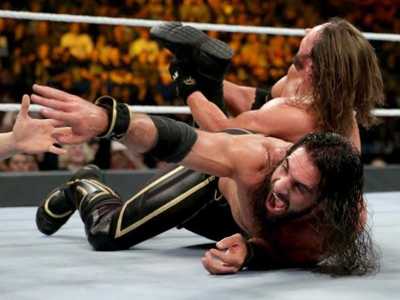 Seth Rollins looks to survive a calf crusher (WWE )