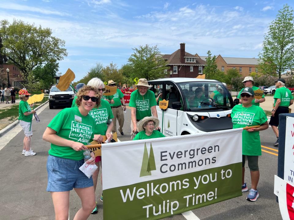 Seniors from Evergreen Commons welcome visitors to Tulip Time during a parade. The organization recently received a $380,000 grant that it will use to support "vibrant aging" in the community.