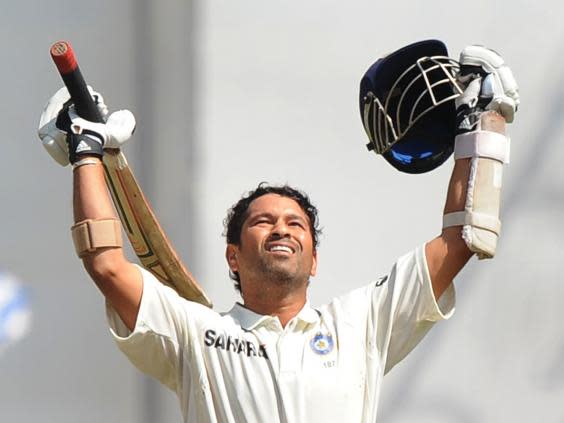 Indian cricketer Sachin Tendulkar celebrates after scoring a double century. He scored his first double century on 24 February 2010 (AFP/Getty)