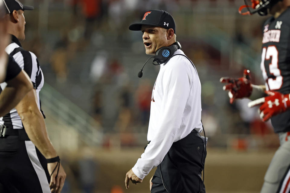 Texas Tech coach Matt Wells yells out to a referee during the second half of an NCAA college football game against TCU, Saturday, Oct. 9, 2021, in Lubbock, Texas. (AP Photo/Brad Tollefson)