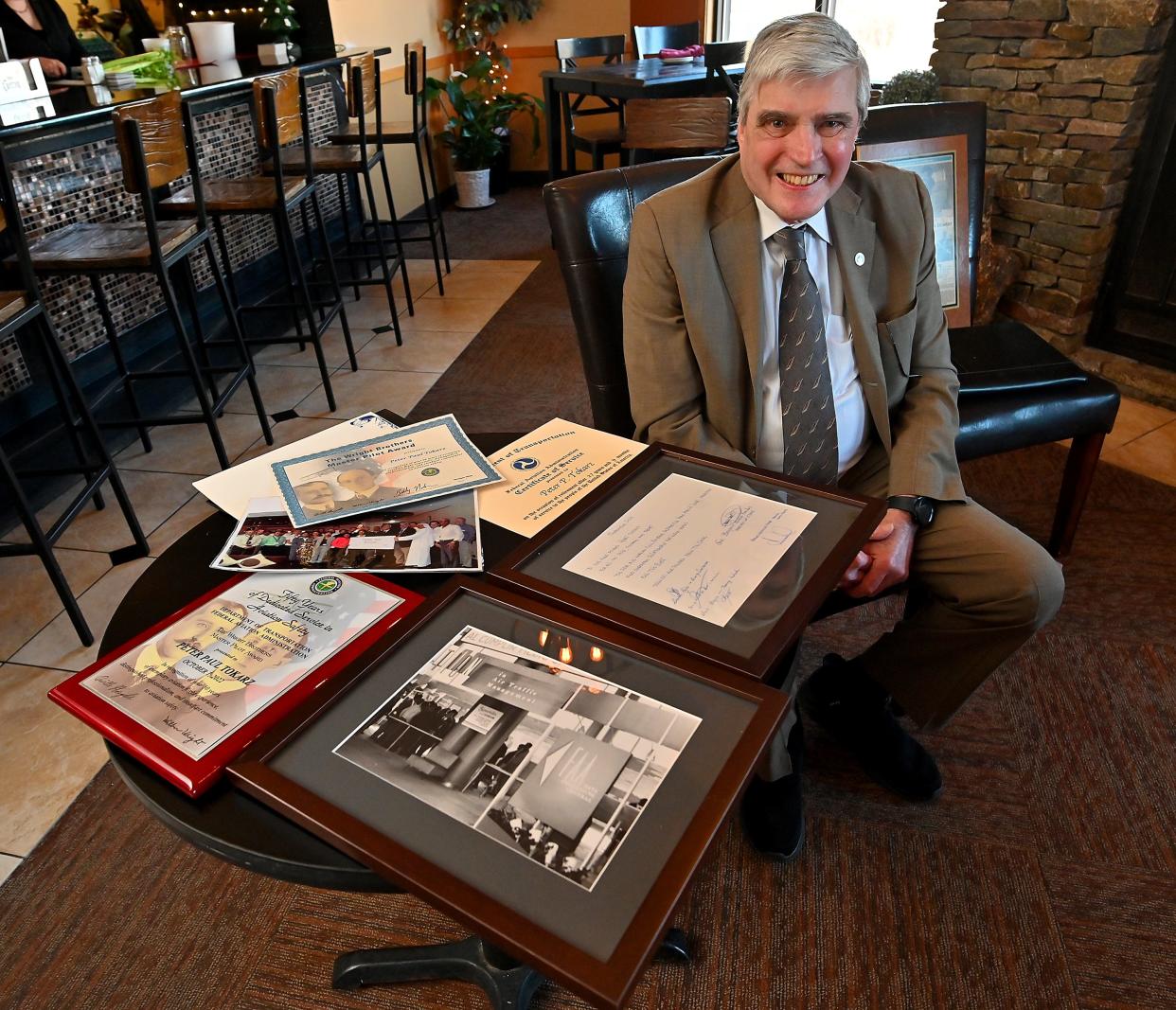 Peter Tokarz of Worcester with some of the awards and certificates presented to him for his 50 years of aviation and military experience.