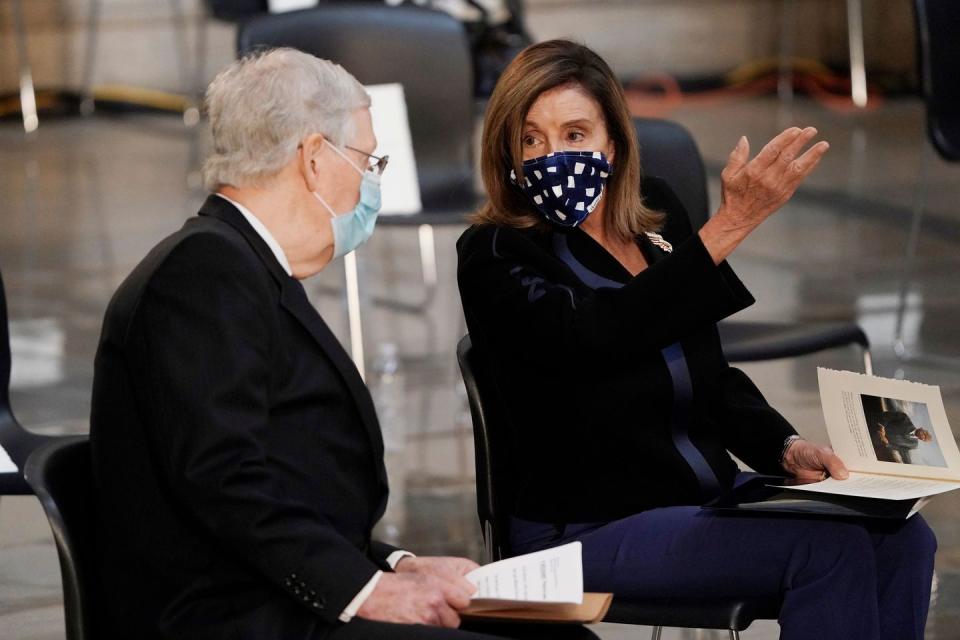 <p>House Speaker Nancy Pelosi and Senate Majority Leader Mitch McConnell, both wearing masks and sitting six feet apart, spoke prior to the service. </p>