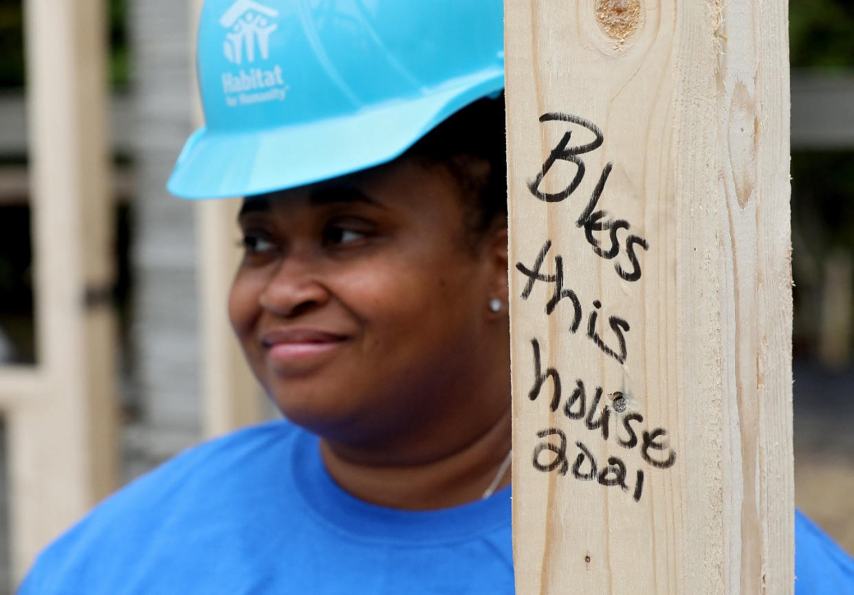 April volunteering during installation 3D-printed house walls at a Habitat for Humanity site. (Consociate Media)