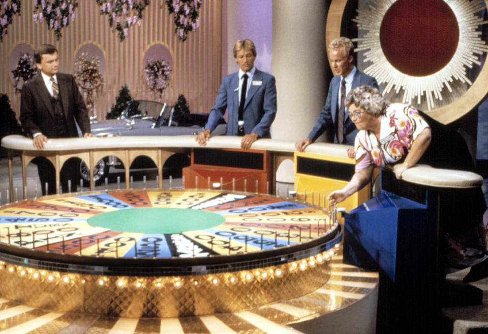 People playing "Wheel of Fortune"